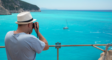 Photographer photography boat on the sea