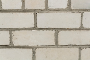 The facade of the old house. Texture. Brick wall