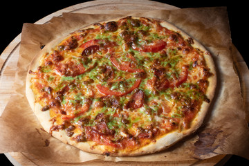 Top view of pizza on baking paper