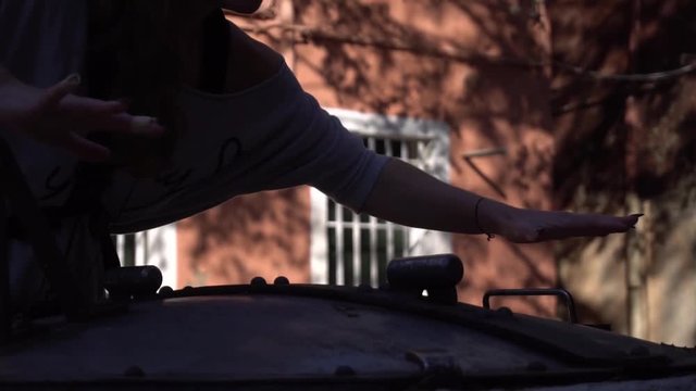 Girl runs her hands over the boiler
