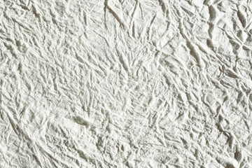 Gray paper background, like concrete, backdrop wrinkled creased and empty isolated background 