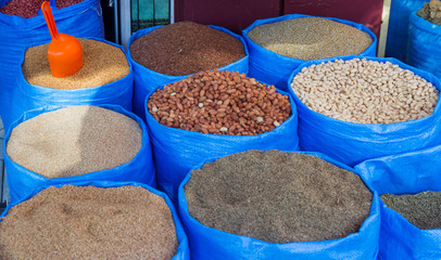 Sacks of spices at a stall in a bazaar in Tangier in Morocco