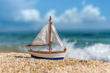 Miniature fishing boat at beach