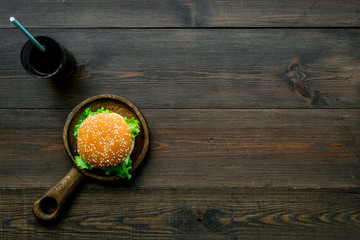 National american food concept with burgers and drink on wooden background top view copyspace