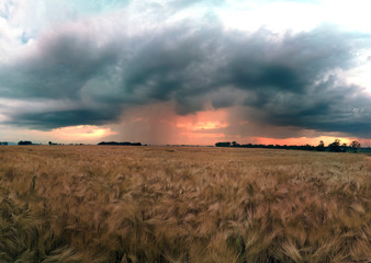 Beautiful sunset and storm clouds over the fields, on the last day of spring, in Biskupice Podgorne...