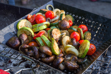 Cooking vegetables on the grill. Barbecue grill. Fry vegetables.