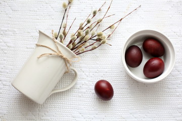 Easter still life with egg and willow on white background