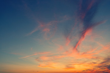 A beautiful sky during dawn with minor clouds. Sun already hid behind horizon.