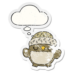 cute cartoon owl in hat and thought bubble as a distressed worn sticker