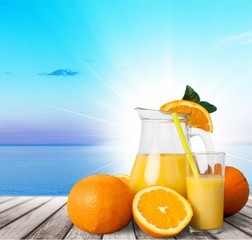 Orange juice and slices of orange on background © BillionPhotos.com