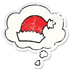 cartoon christmas hat and thought bubble as a distressed worn sticker
