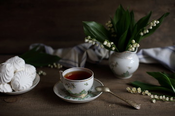 tea with marshmallows and lilies of the valley