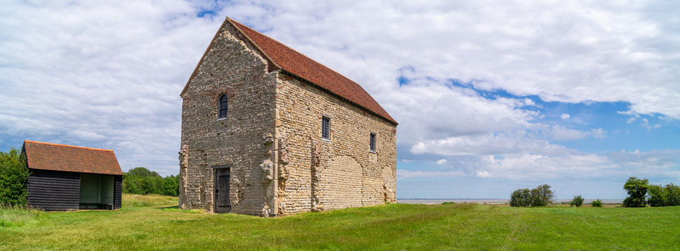 Looking at the nave of St Peter's 7th-century chapel, Bradwell-on-Sea, built of reused Roman materials on the entrance of Othona Roman fort