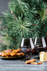 Christmas dessert - a traditional cookie on the background of a green Christmas tree.