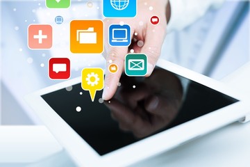 Businessman and tablet pc  on  background