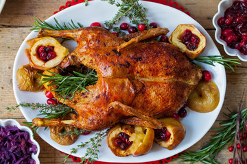 Festive roast duck with apples and cranberries