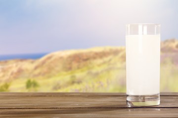 Glass of milk  for breakfast on  background