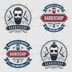 Set of vintage Barber Shop logos, labels, emblems or badges. Vector illustration