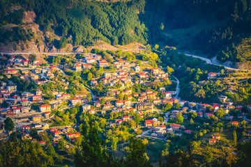 Destination - Anilio town in north of greece mountains during the sunset