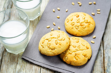 Italian pine nuts cookies with glasses of milk