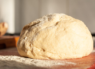 Ball of fresh dough, bathed in warm evening sunlight