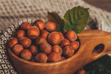 Hazelnuts in wooden bowl, close up