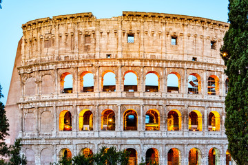 Naklejka premium Colosseum, or Coliseum. Illuminated huge Roman amphitheatre early in the morning, Rome, Italy