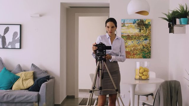A professional Real Estate Agent taking a photo of a property, fixing the frame to perfection.