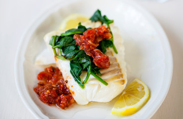 Cod fillet with spinach and tomato salsa