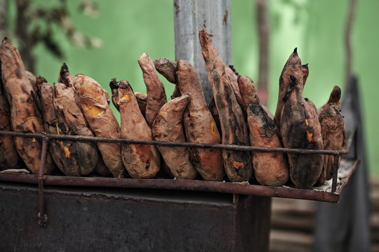 Roasted yellow-fleshed sweet potatoes as street food. Hotan Livestock Market-Xinjiang-China-0189