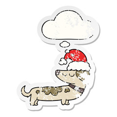 cartoon dog wearing christmas hat and thought bubble as a distressed worn sticker