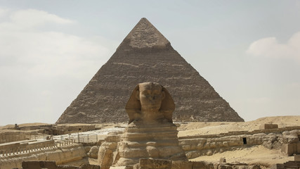 the front of the sphinx and pyramid of khafre at giza near cairo