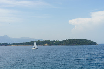 Scenic view on the sea and Vido Island in the Corfu Town in a sunny day