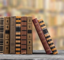 Books and glasses on  table  background,close up