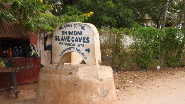 Static shot of the Shimoni slave caves sign, in Kwale, Kenya, Africa