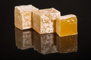 lokum Turkish delight, sweets on a black background (dessert sweets). food background. top view. copy space