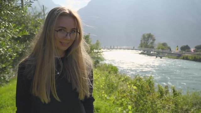 Teenage Girl Walking Along hte River