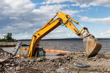 Excavator(construction equipment) drowned on the lake while working to strengthen the shore. Safety...