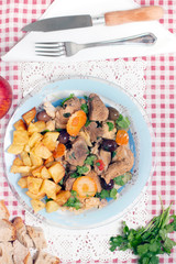cooked meat with potatoes