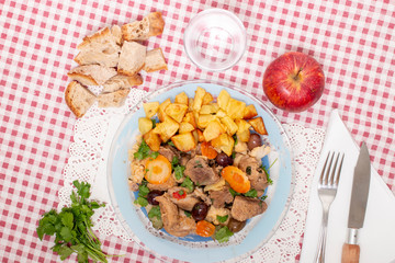 cooked meat with potatoes