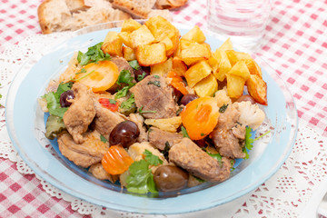 cooked meat with potatoes