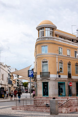 Curved yellow building in Faro city