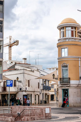 Fototapeta na wymiar Curved yellow building in Faro city