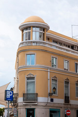 Fototapeta na wymiar Curved yellow building in Faro city