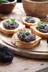 Bruschetta with black truffle ,salsa tartufata.