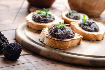 Bruschetta with black truffle ,salsa tartufata.