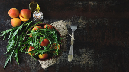 Fototapeta na wymiar Banner. Healthy arugula salad apricot. Dietary food. Bright healthy salad. Super Food