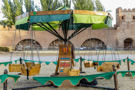 ancient wooden carousel in a medieval festival celebrated in alcala de henares, spain
