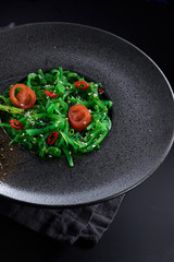 Chuk salad on a black plate