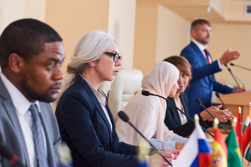 Confident mature female delegate in formalwear